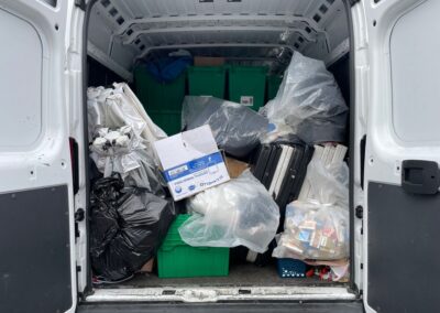 Image of stolen items in the back of a van with doors open